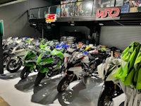 a group of motorcycles parked in a garage