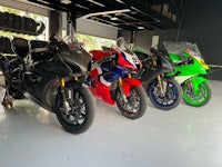 a group of motorcycles parked in a garage