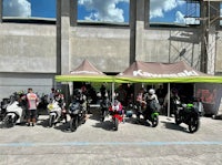 a group of motorcycles parked in front of a building