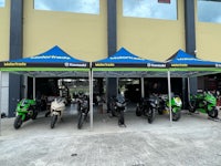 a group of motorcycles parked in front of a building